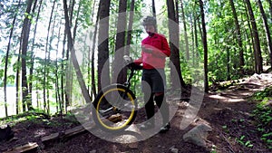 Woman standing with unicycle and using mobile phone 4k