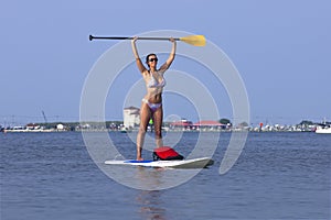 Woman on a Standing Up Paddleboard SUP photo