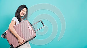 Woman standing wear white t-shirt, holidays travel concept, her hugging suitcase