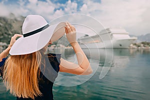 Woman stands on cruise liner background