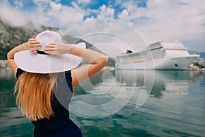 Woman stands on cruise liner background