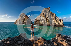 WoMan stands near Fernando de Noronha beach