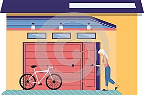 Woman stands near garage with opening door and bicycle. Storage space for bike, room for transport