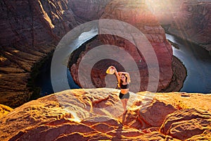Woman Stands Over the Edge of Horseshoe Bend. Arizona Horseshoe Bend of Colorado River in Grand Canyon. Travel and