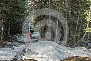 Woman Stands on Snow Bank on Mount Gibson