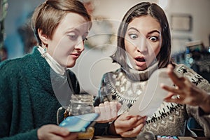 Woman stares at the check for dinner at the restaurant, her eyes bulging. The concept of inflation and devaluation of money