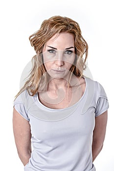 Woman staring intense with angry and defiant eyes in disappoint face expression photo