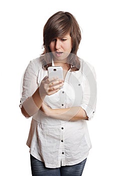 Woman staring at smartphone in shock