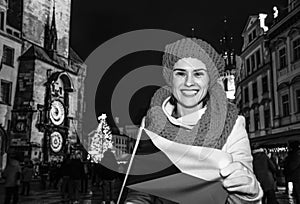 Woman on Staromestske namesti in Prague showing Czech flag photo