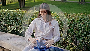 Woman start reading park bench immersed tranquility. Absorbed in book young lady