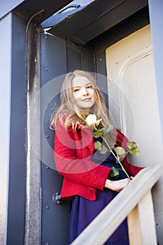 Woman at station next to stain door