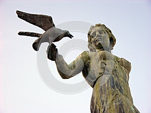 Woman statue with seagull in Opatija in Croatia