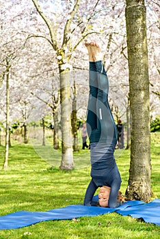 Woman staying in Salamba Sirsasana