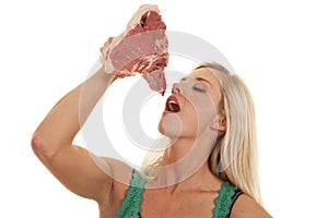 Woman with steak by mouth