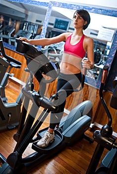 Woman on stepper in gym