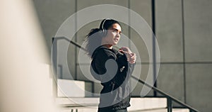 Woman on steps for exercise, warm up with headphones in muscle workout and city morning body training. Urban fitness