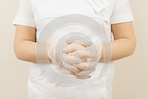 Woman in sterile gloves