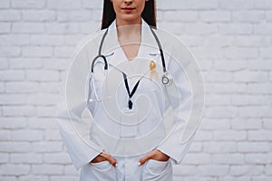 Woman with Stethoscope Support People in Clinic.