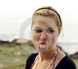 Woman sticking out her tongue