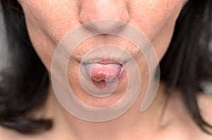 Woman sticking out her tongue at the camera