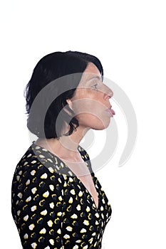 Woman sticking out her tongue on white background