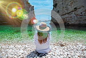 Woman on Stiniva beach in Vis in Croatia