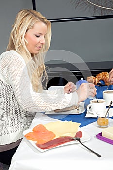 Woman stirring her morning coffee