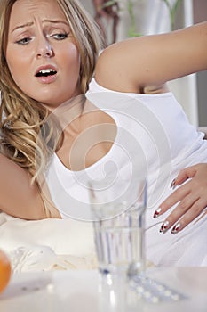 Woman with stomach cramps