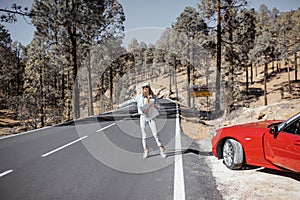 Woman stopping car while traveling