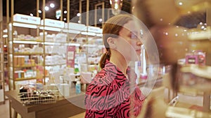 Woman in the store choosing cosmetics