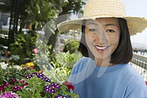 Woman in straw hat gardening