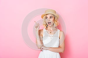 Woman in straw hat having idea