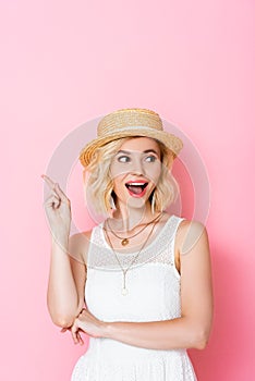 Woman in straw hat having idea