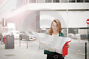 Woman on the street with a map