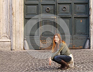Woman on the street sitting