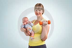 Woman strengthens with dumbbell after childbirth