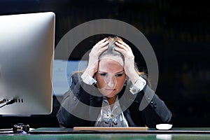 Woman in stress in front of computer