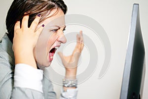 Woman in stress in front of computer