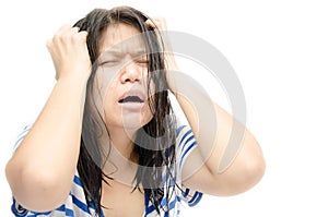 Woman stressed is going crazy pulling her hair in frustration.