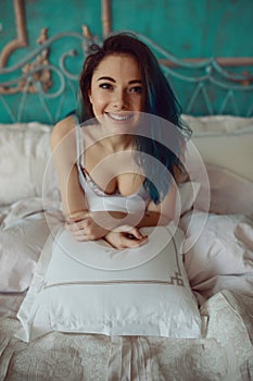 Woman stretching in bed after wake up