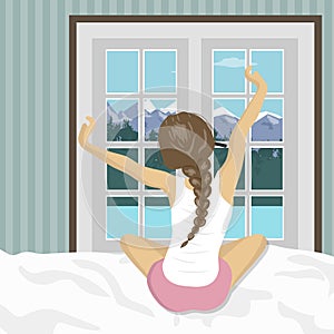 Woman stretching in bed after wake up. Concept for holidays and vacations. Summer mountain scenery photo