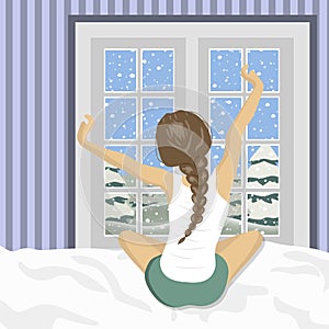 Woman stretching in bed after wake up. Concept for holidays and vacations. Winter scenery. Flat