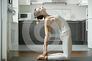 Woman stretching in Camel exercise