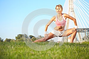 Woman stretching hamstring leg muscles