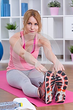 Woman stretching hamstring muscles