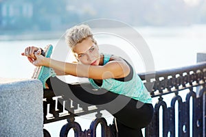 woman stretching her leg before morning jogging