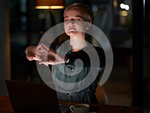 Woman stretching at her office desk for health, muscle wellness and calm night energy for work life balance. Young
