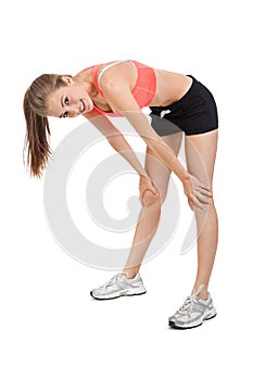 Woman stretching legs after jogging isolated