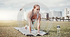 Woman, stretching legs and resistance band in the city for workout, exercise or training on yoga mat. Female yogi in
