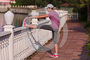 Woman stretching before morning jogging